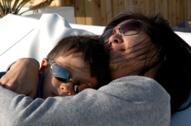 mom and d cuddling on terrace